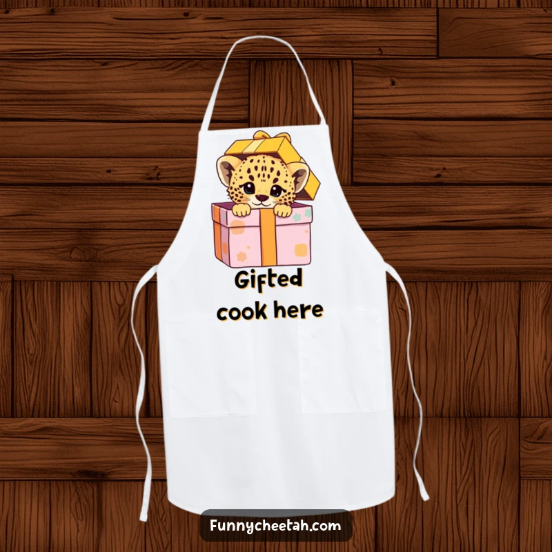 Funny apron showcasing a cheetah cub peeking playfully from an oversized gift box, designed for cooks who enjoy fun and delightful surprises.