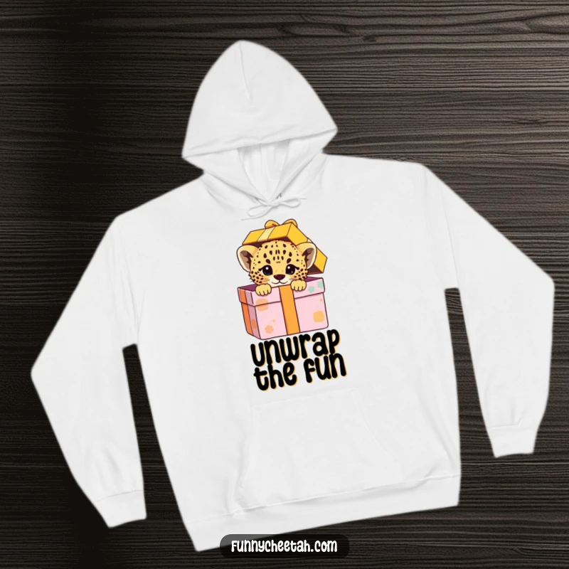 Funny hoodie depicting a cheetah cub peeking out of a colorful gift box with a playful expression, combining comfort with the joy of surprise.
