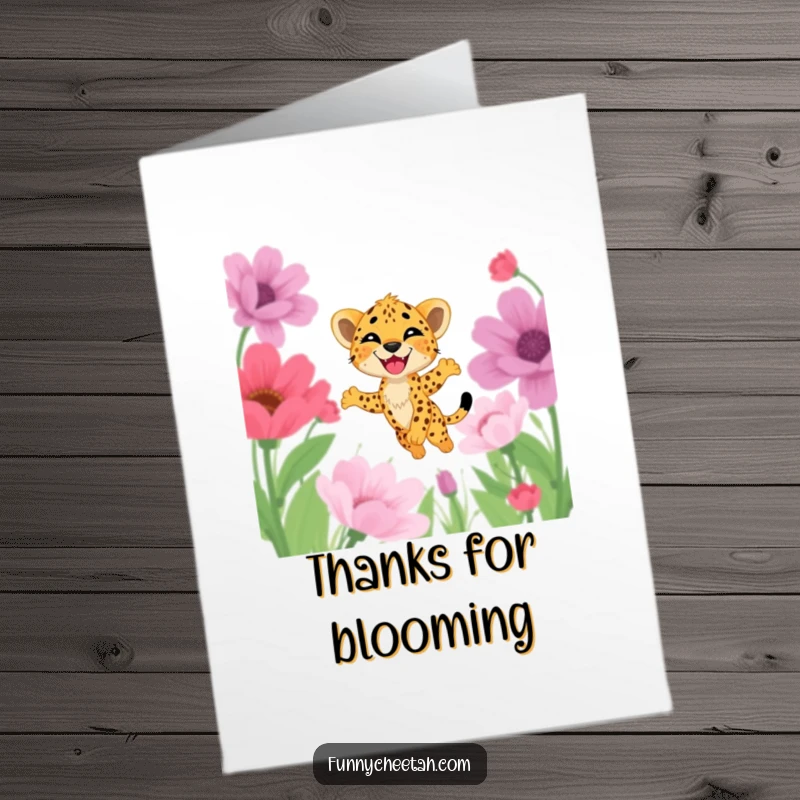 Funny Free Printable Cheetah Cub Thank You Card: Cub with a delighted grin leaps through oversized flowers, expressing thanks.