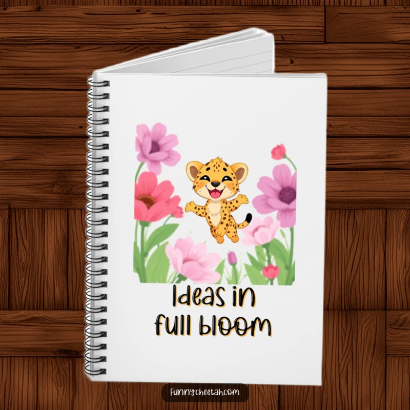 Funny notebook featuring a cheetah cub with a wide grin leaping through a field of oversized flowers, perfect for capturing joyful thoughts.