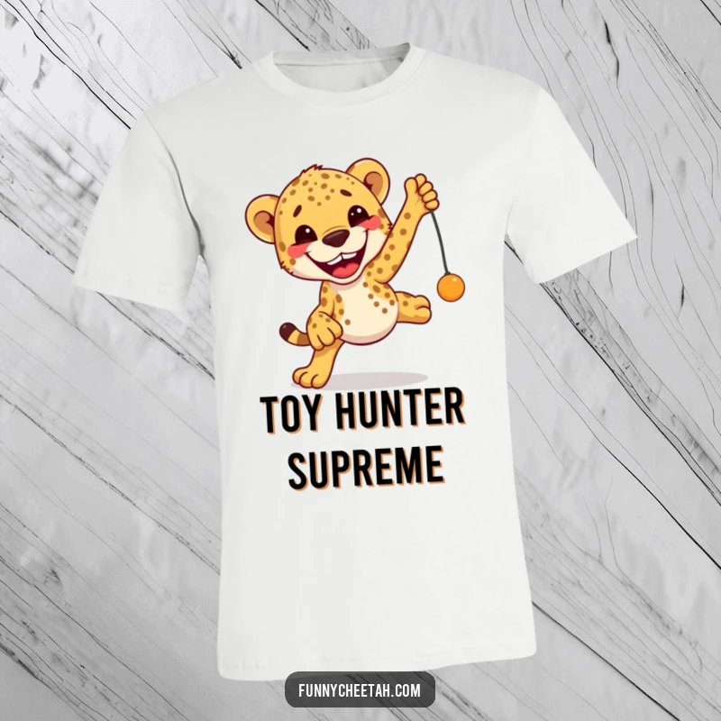 Funny Cheetah T-Shirt showcasing an excited cheetah mid-leap with a massive grin, reaching for a toy, embodying pure fun.