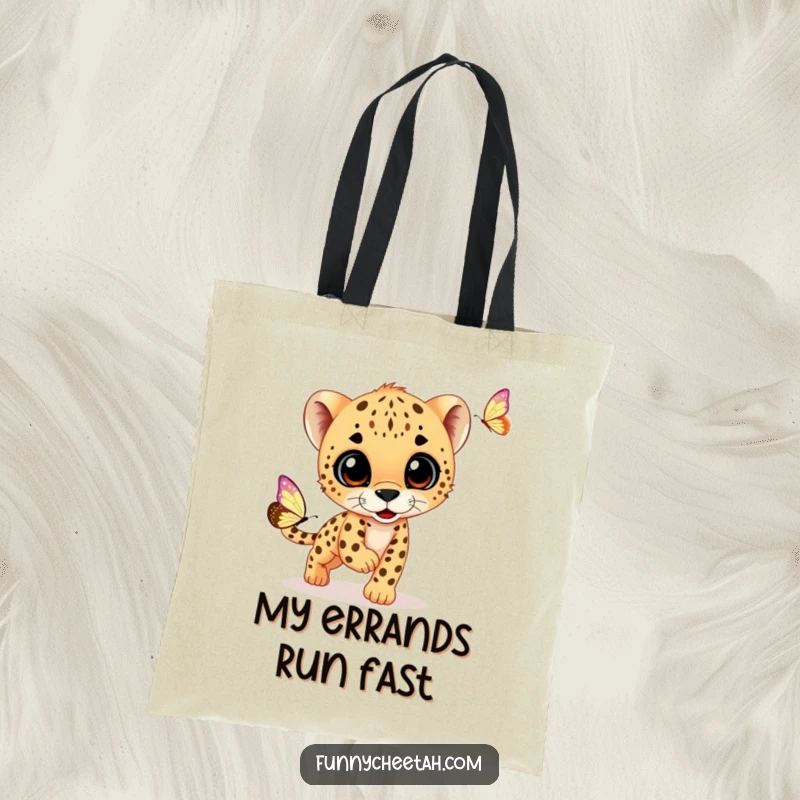 Funny tote bag depicting a cheetah cub in joyful pursuit of a dazzling butterfly, perfect for carrying groceries or essentials with a smile.